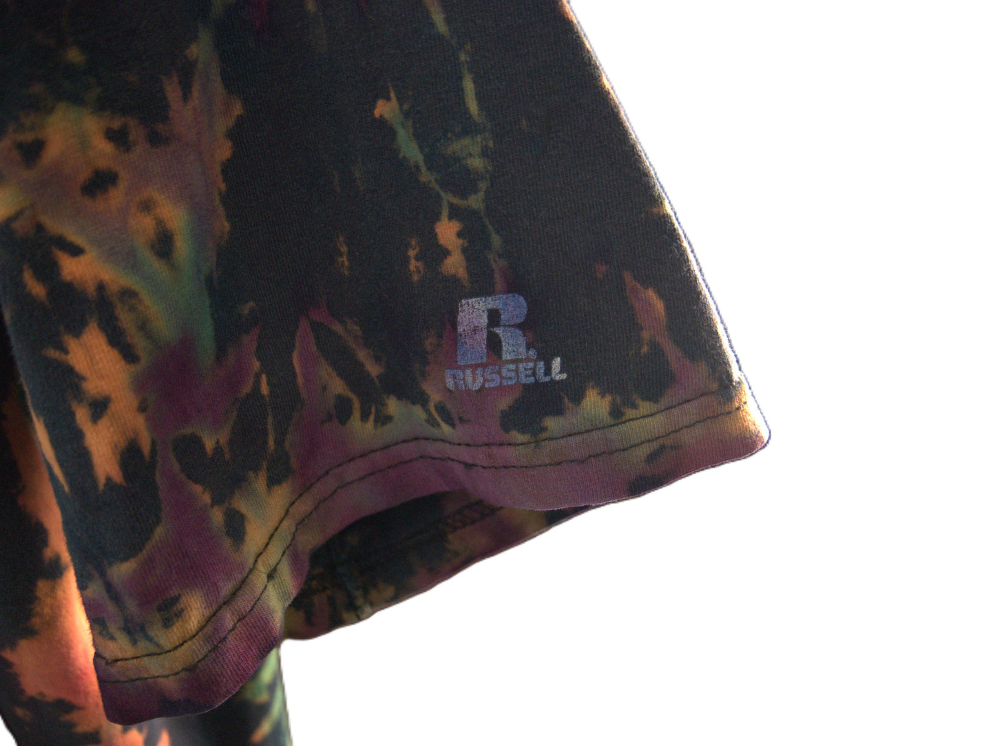 Ocular Reverse Tie Dye T Shirt using a Spiral Design in Green, Orange and Black, in size Large, showing sleeve detail