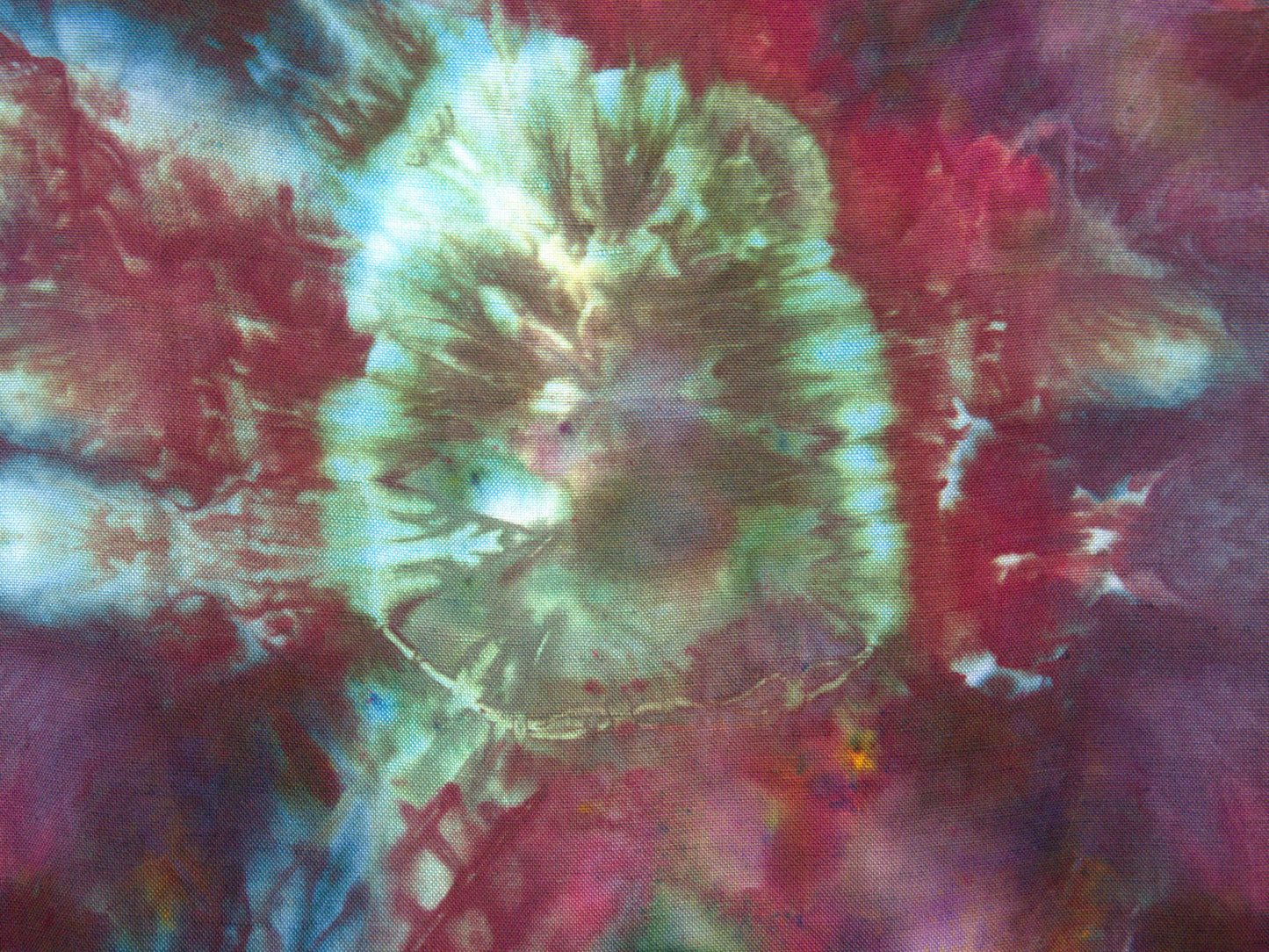 Purple teal tie dye pattern detail on upcycled blouse showing ice dye technique