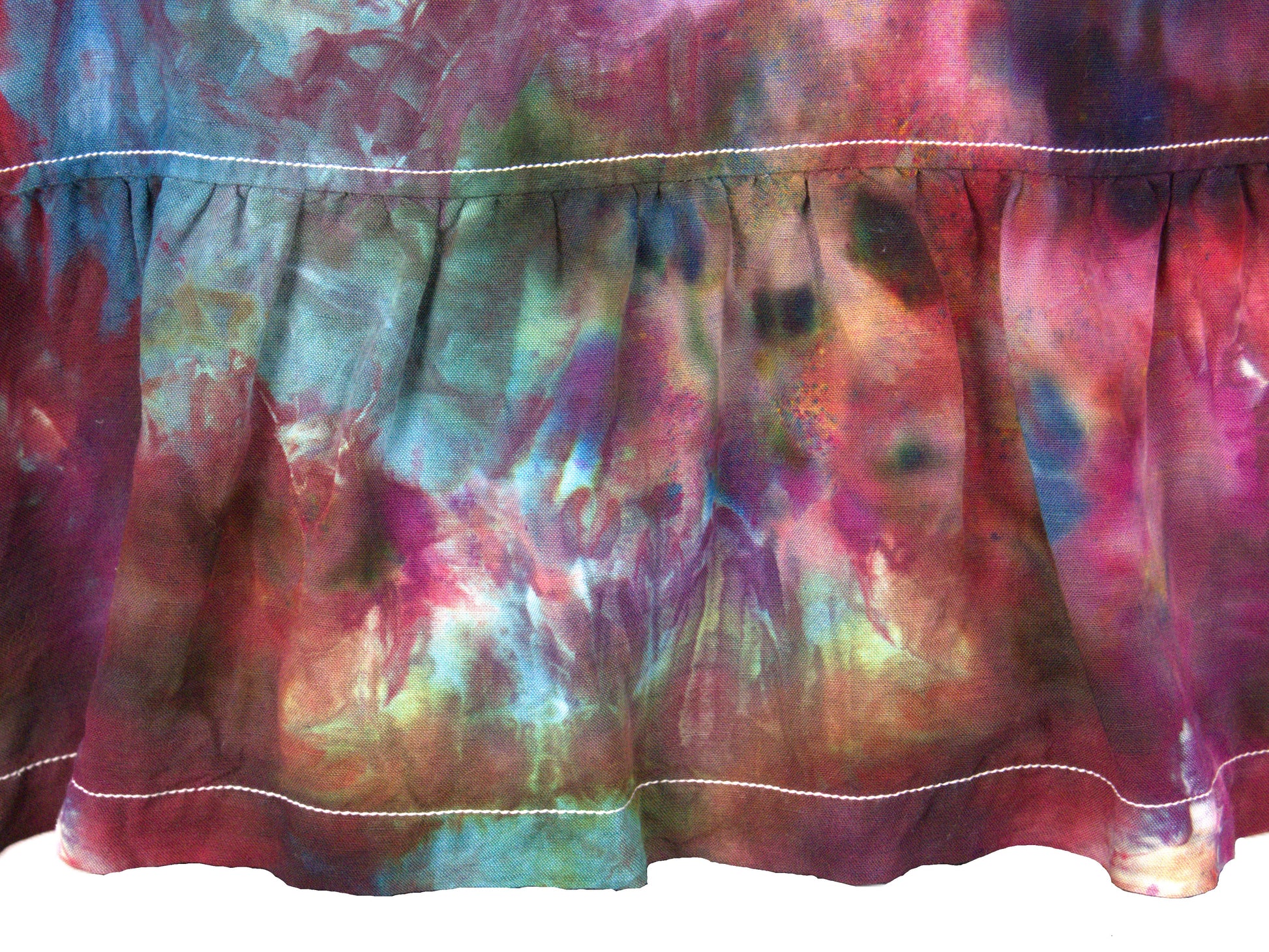 Gathered ruffle waist detail on back tie dye blouse purple teal ice dye pattern close up
