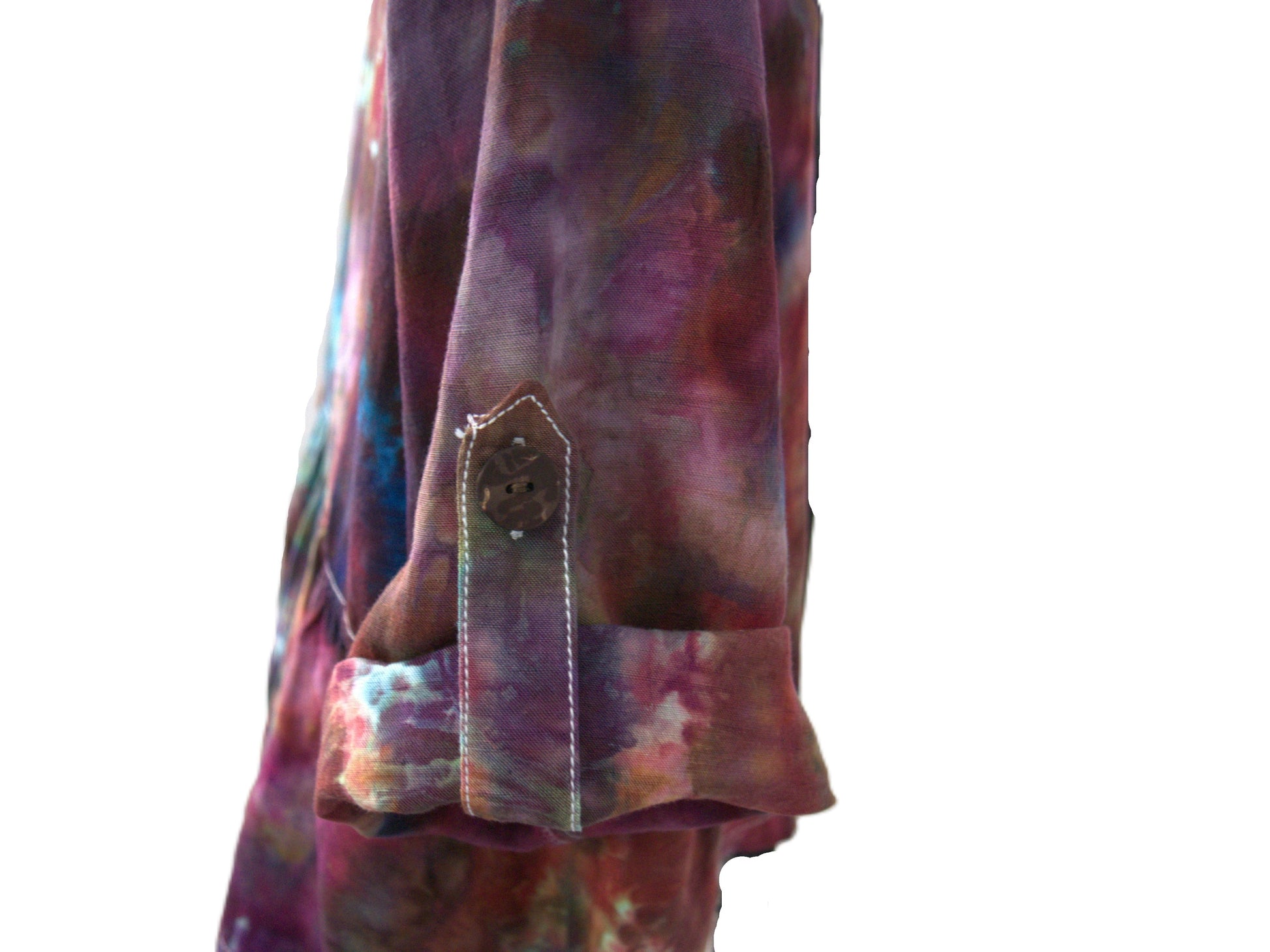 Roll tab right sleeve detail on upcycled tie dye blouse showing button closure hand dyed