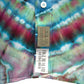 Turquoise, Red and Blue short sleeve tie dye button down dress shirt in an experimental style, showing front label detail