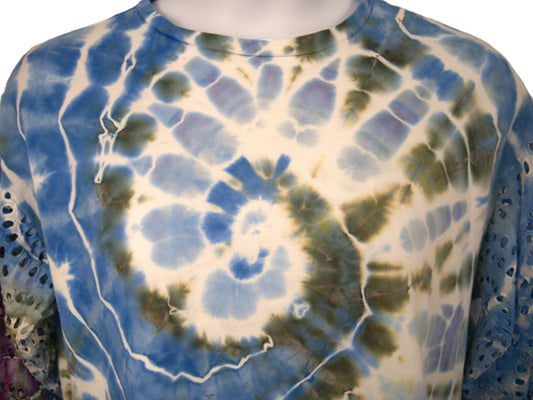 Close up spiral tie dye pattern blue green purple hand dyed cotton top detail