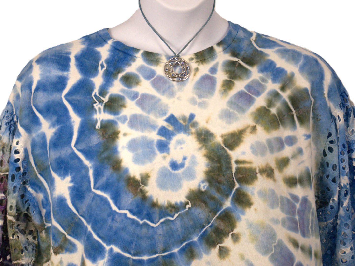 Styled tie dye top close up blue green spiral pattern eyelet sleeves boho jewelry